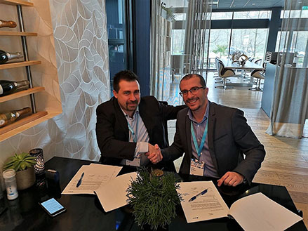 ABRIS CEO Zsolt Gödry and IMS' General Manager Imad Habchi sign agreement