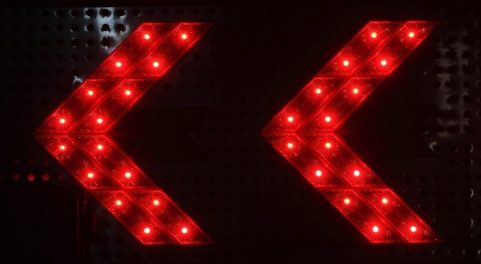 Two red LED arrows pointing left